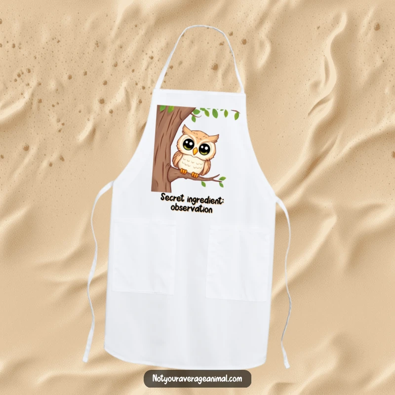 Funny apron showing a curious owl with big eyes peeking from a tree, bringing observant charm to kitchen tasks.