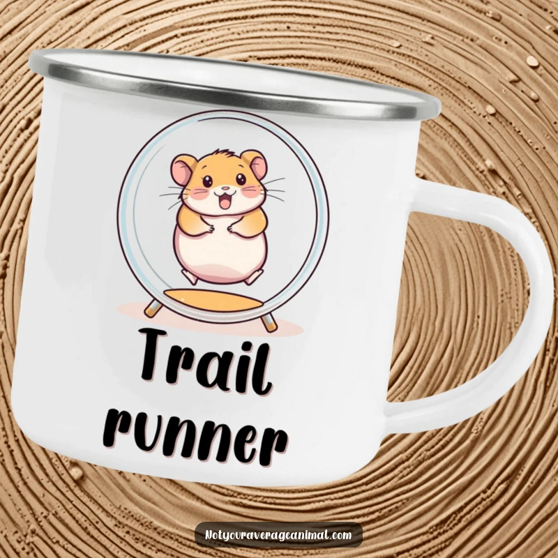 Funny enamel camping mug with a chubby hamster spinning enthusiastically inside a transparent exercise wheel, ready for outdoor adventures.