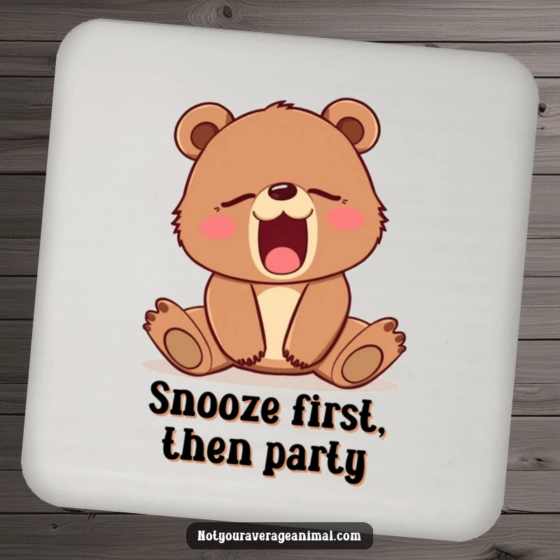 Funny drink coaster with a sleepy brown bear cub yawning adorably. Protects surfaces with a touch of humor.