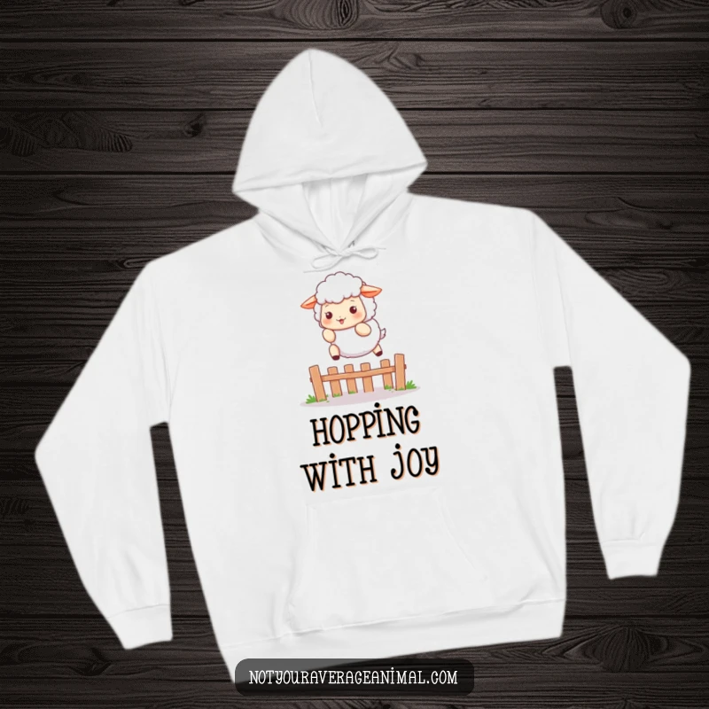 Funny hoodie showcasing a fluffy sheep character playfully leaping over a small fence, perfect for cozy, whimsical, and farm-themed comfort.