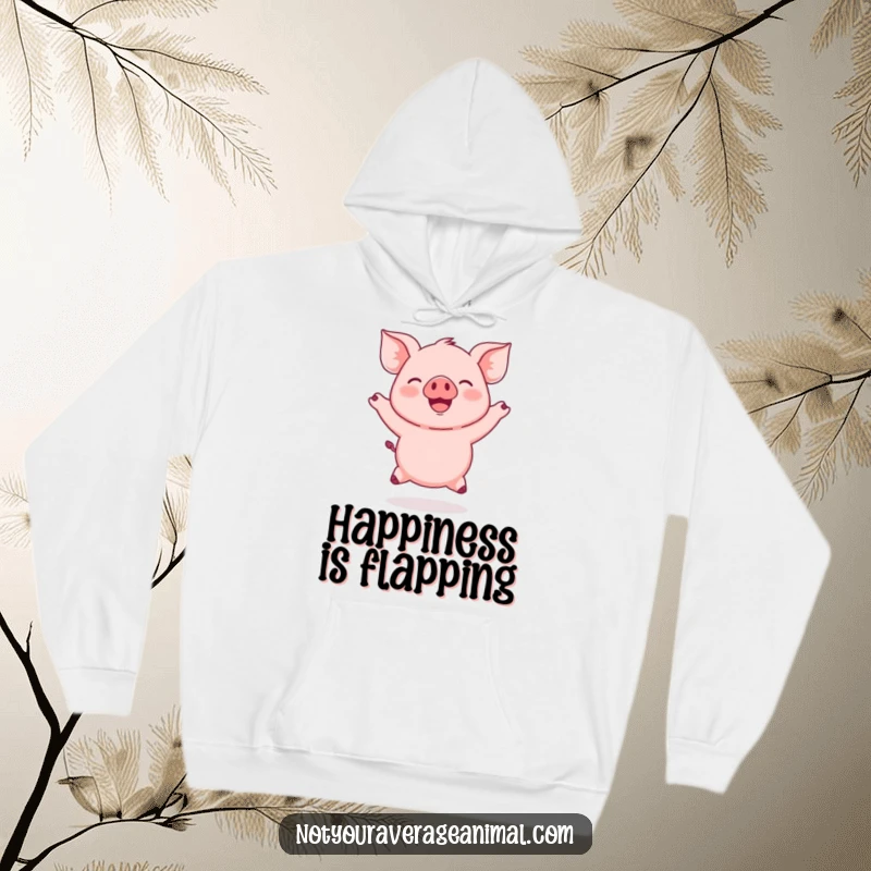 Funny Pink Piglet Hoodie featuring a round, pink piglet joyfully jumping with ears flapping, perfect for cozying up happily.