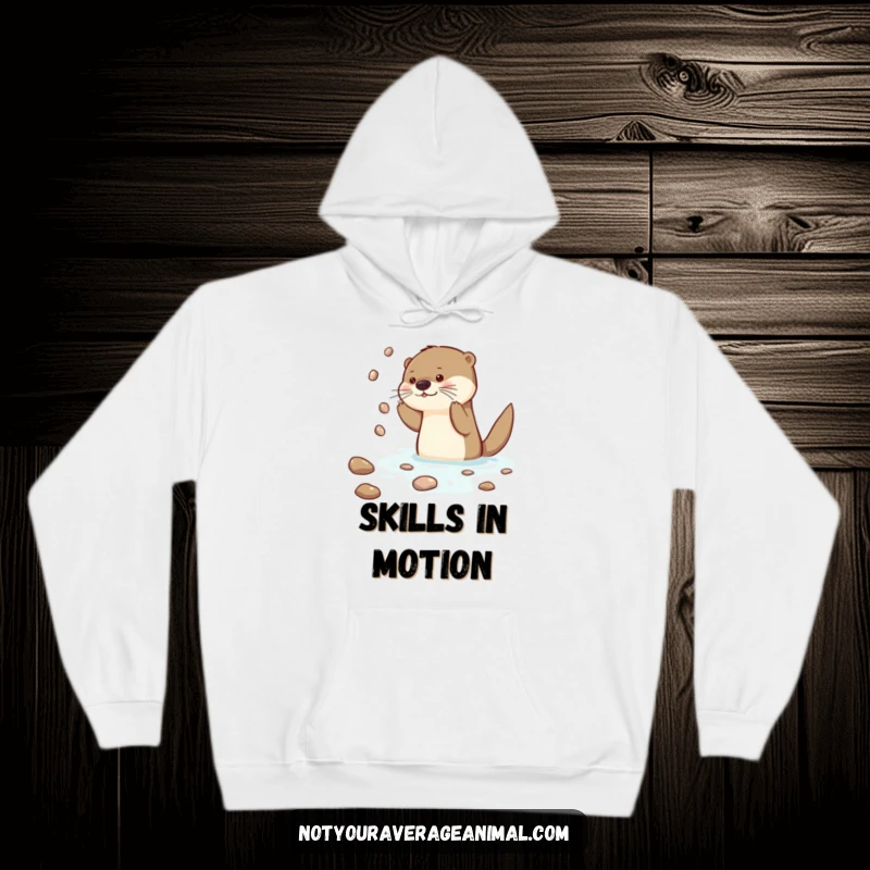 Funny Otter Hoodie depicting a curious otter character juggling shiny pebbles with focus and skill in its watery habitat.