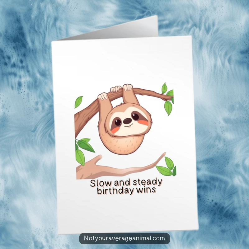Funny free printable birthday card of a smiling sloth hanging upside down from a sturdy tree branch.