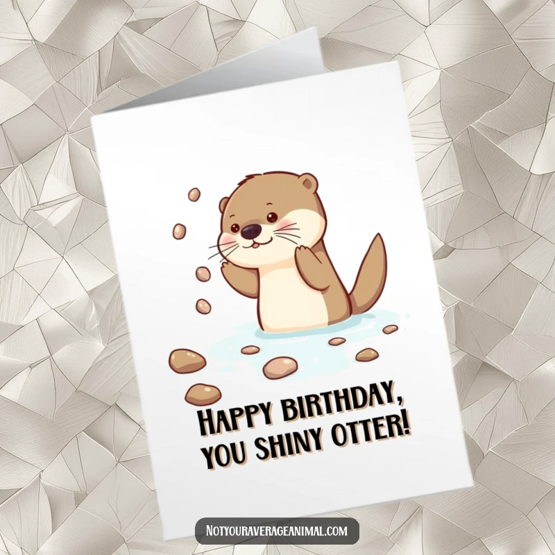 Funny Free Printable Otter Birthday Card: A curious otter juggling shiny pebbles in the water, celebrating a special day. Downloadable art.