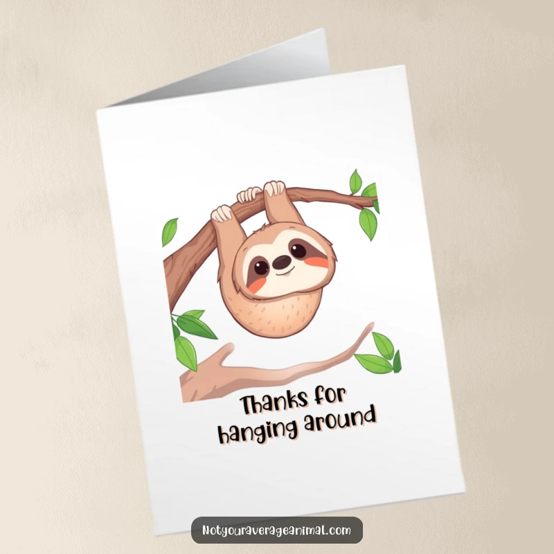 Funny free printable thank you card: a smiling sloth hanging upside down, conveying warm appreciation.