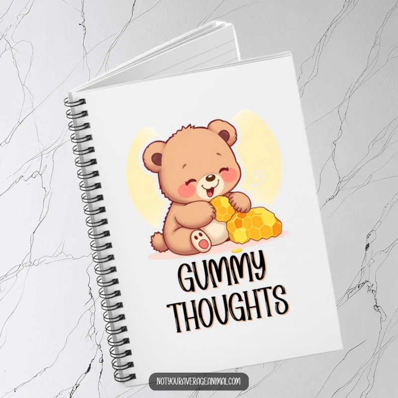 Funny bear cub notebook with a giggling cub playing with a honeycomb, perfect for writing.