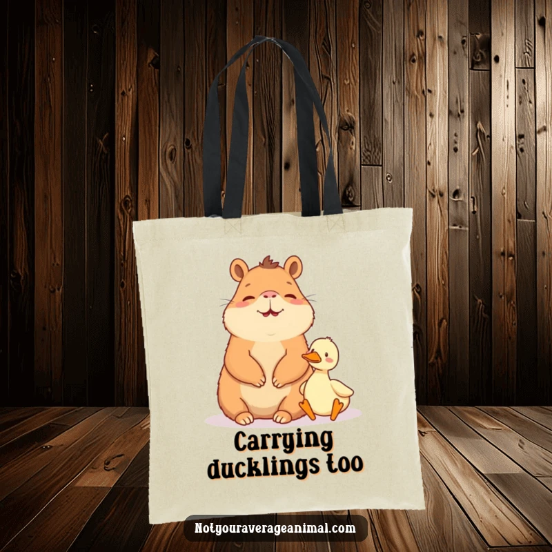 Funny tote bag: A giggling capybara sits peacefully beside a very tiny duck.