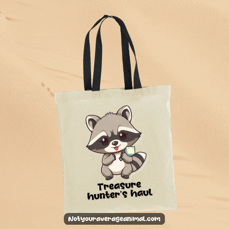 Funny tote bag illustrated with a sly raccoon character pilfering a shiny object, ideal for carrying treasures.