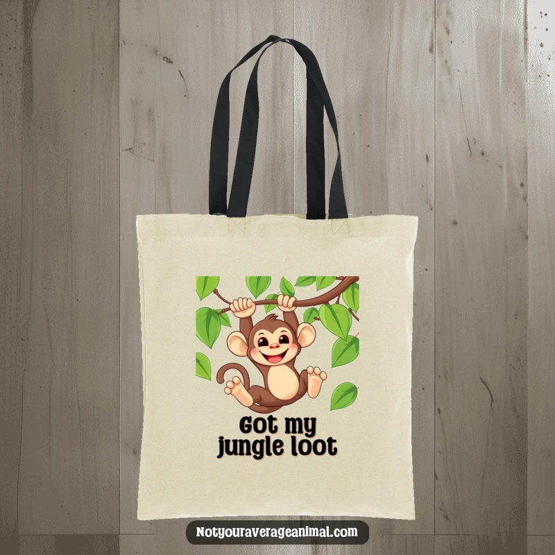 Funny tote bag with a mischievous monkey swinging on a vine, sporting a wide, playful grin.