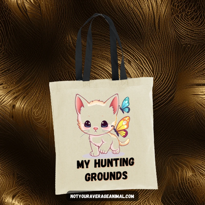 Funny curious kitten playfully chasing a shimmering butterfly, perfect for a cute and humorous tote bag.